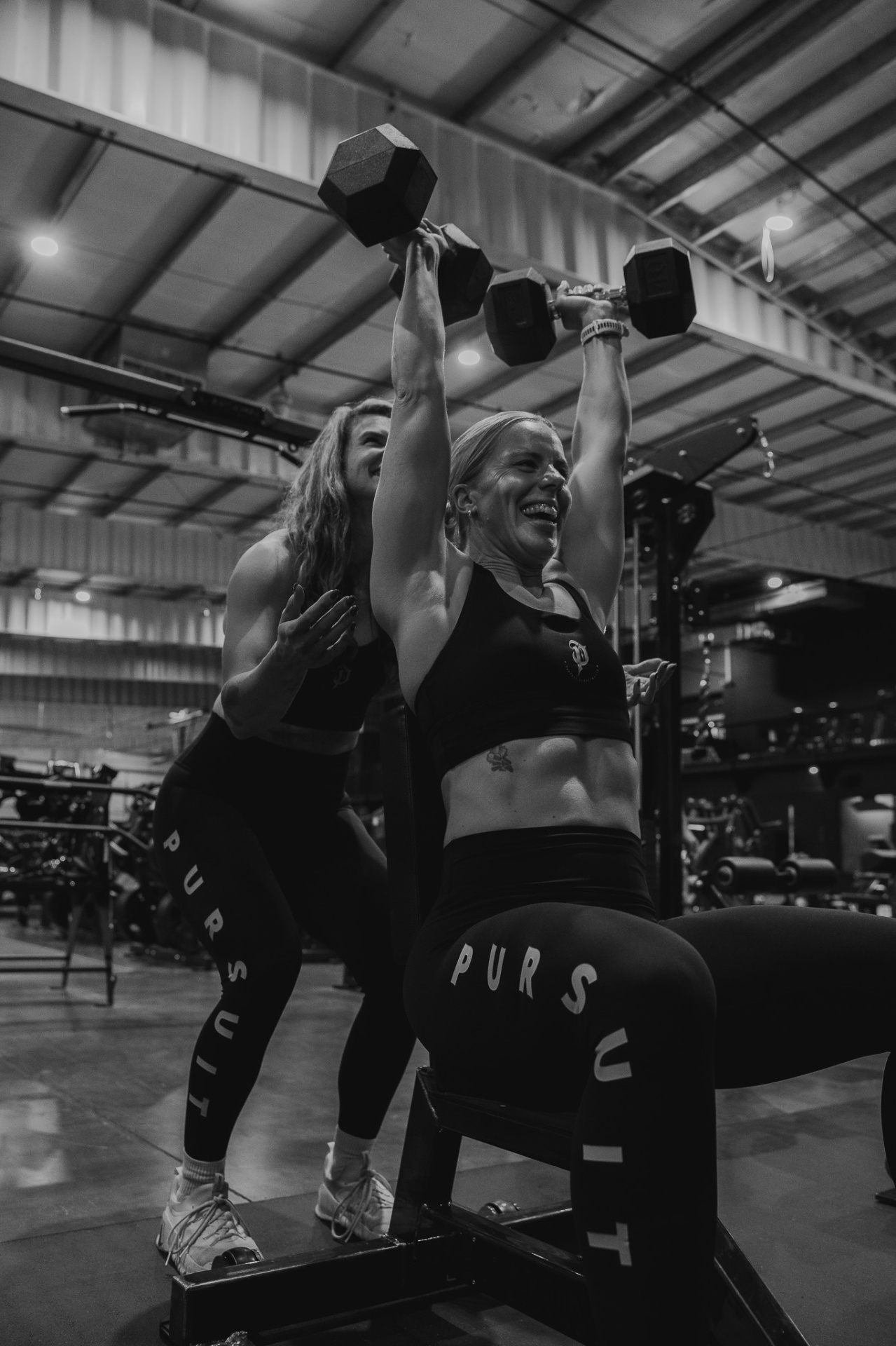 Member spotting a heavy press